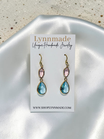 Handmade gold teardrop earrings with a seafoam blue crystal and a blush pink accent