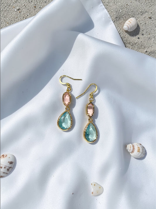 Handmade gold teardrop earrings with a seafoam blue crystal and a blush pink accent