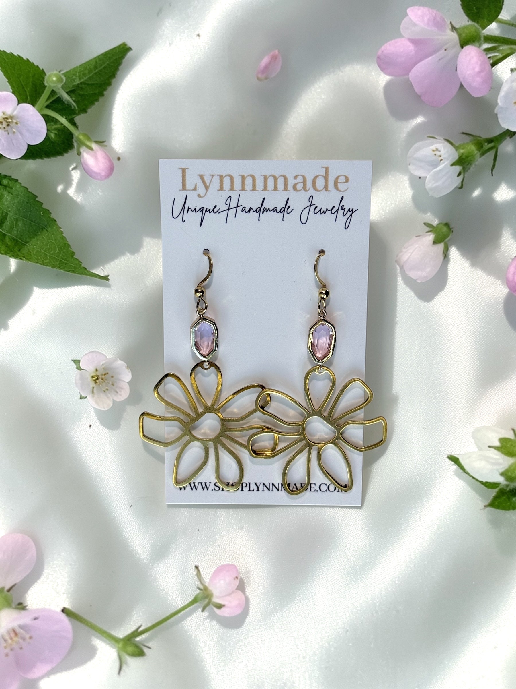 Handmade gold wire flower earrings with a light pink faceted gemstone