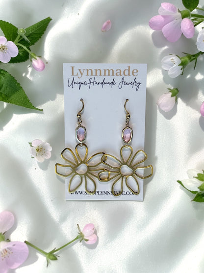Handmade gold wire flower earrings with a light pink faceted gemstone